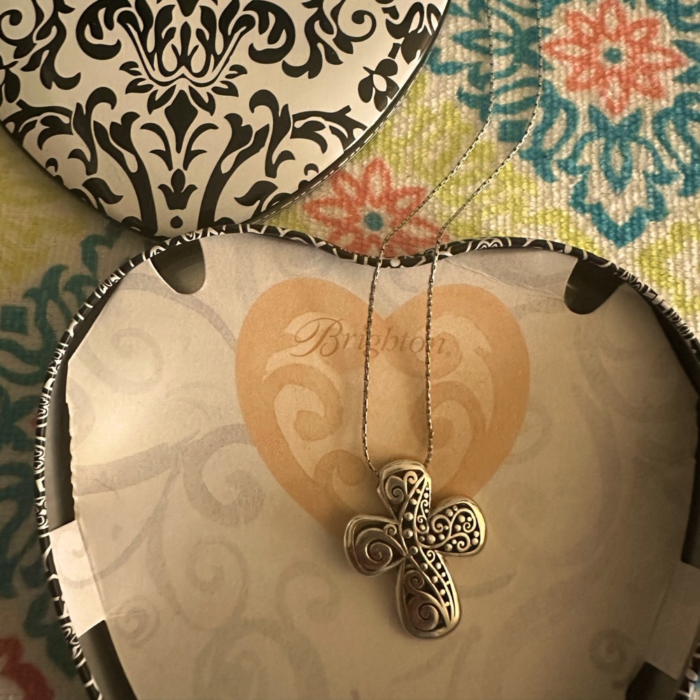 It’s a silver Brighton women’s necklace with cross pendant, in original holder